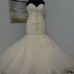 A brand new Allure Bridal wedding gown.